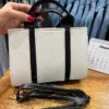 کیف راه راه کرم مشکی
